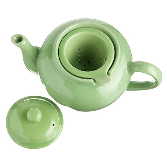 Green ceramic teapot with lid on a white background
