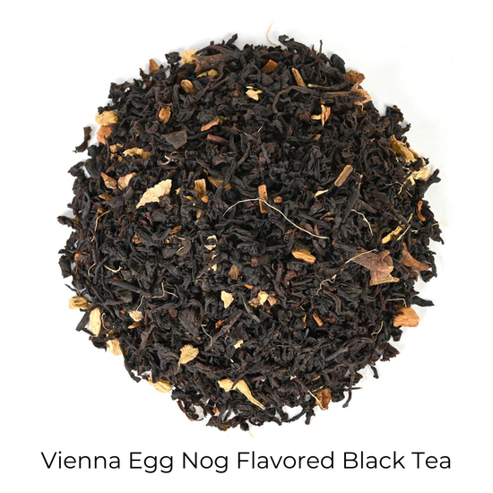 Vienna Egg Nog Flavored Black Tea loose-leaf tea on a white background with product title text callout at bottom