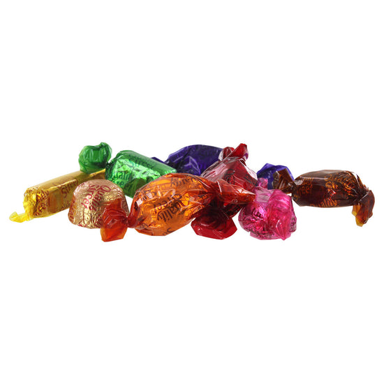Various wrapped pieces of candy of different color wrappings