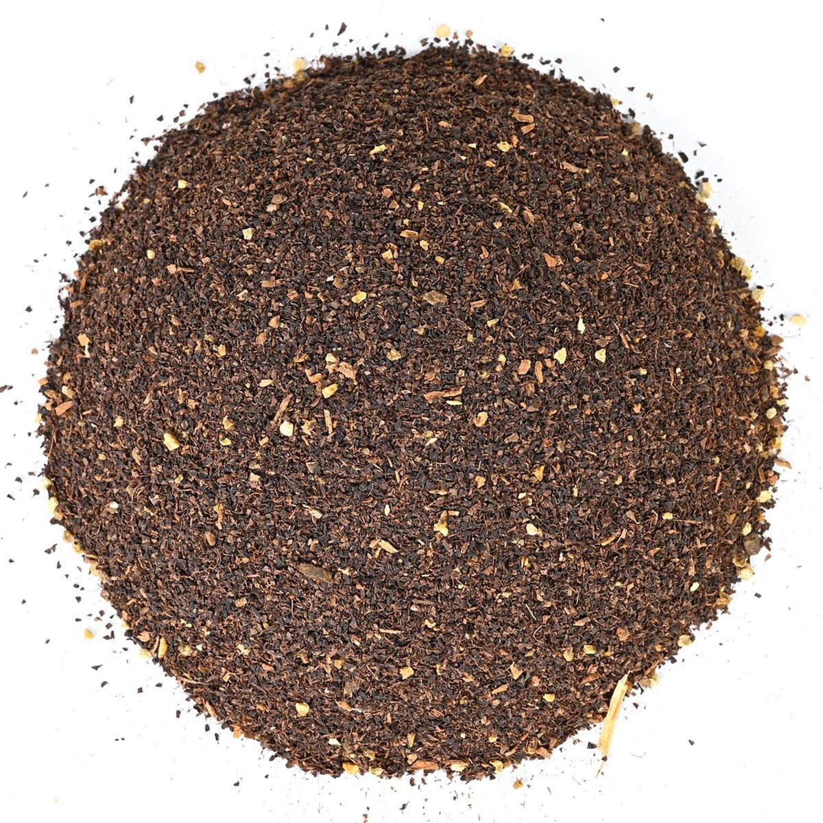 Round pile of coarse ground black loose-leaf tea.
