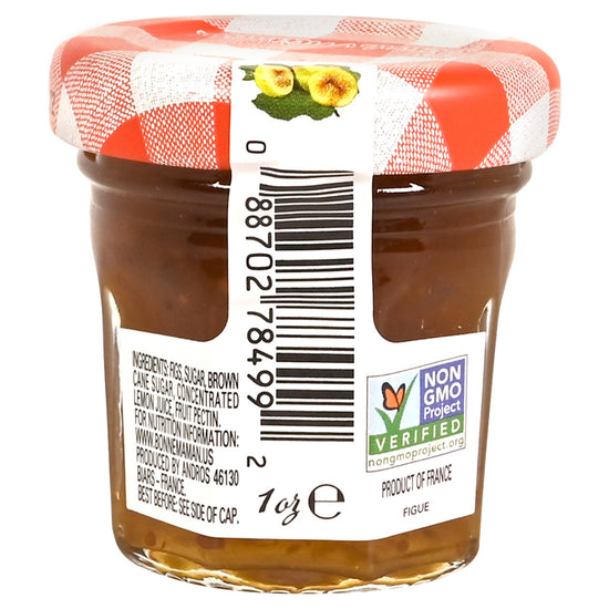 Back of a jar of Bonne Maman Fig Preserves with a red and white checkered lid on a white background