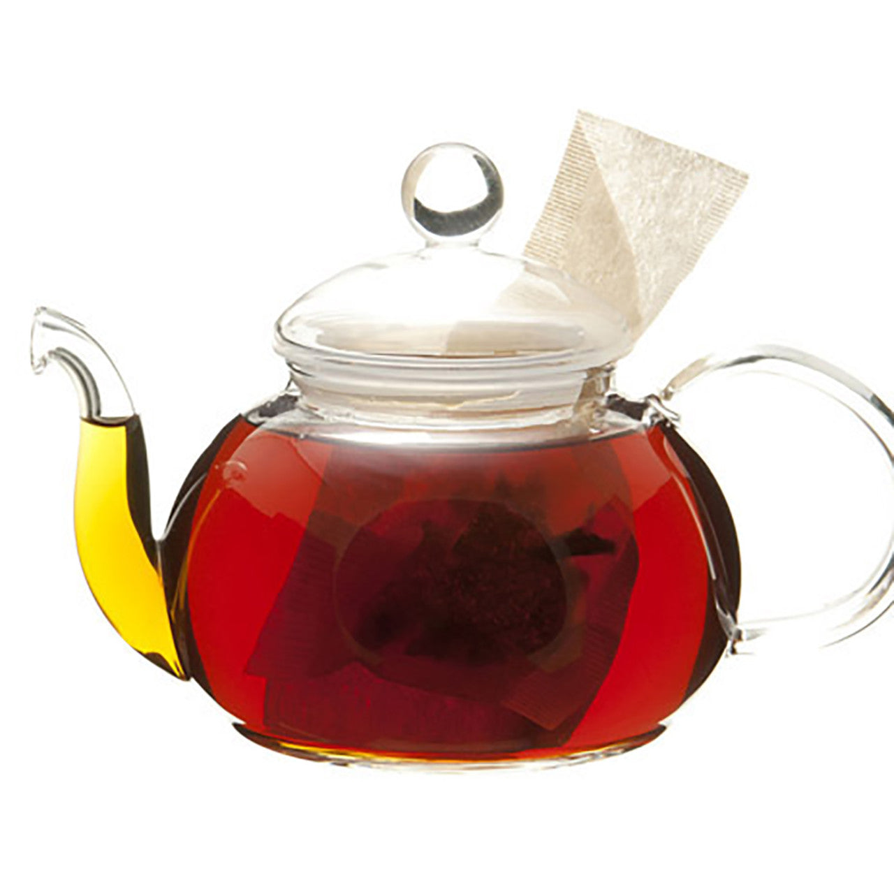 Glass teapot with dark amber tea and a teabag