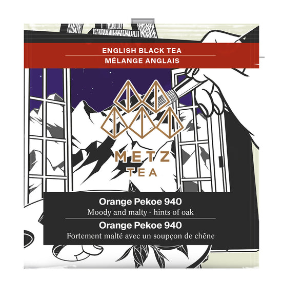 Individually wrapped teabag for Metz English Black Tea Orange Pekoe 940 featuring an illustration of a hand using a paint brush and painting mountains.