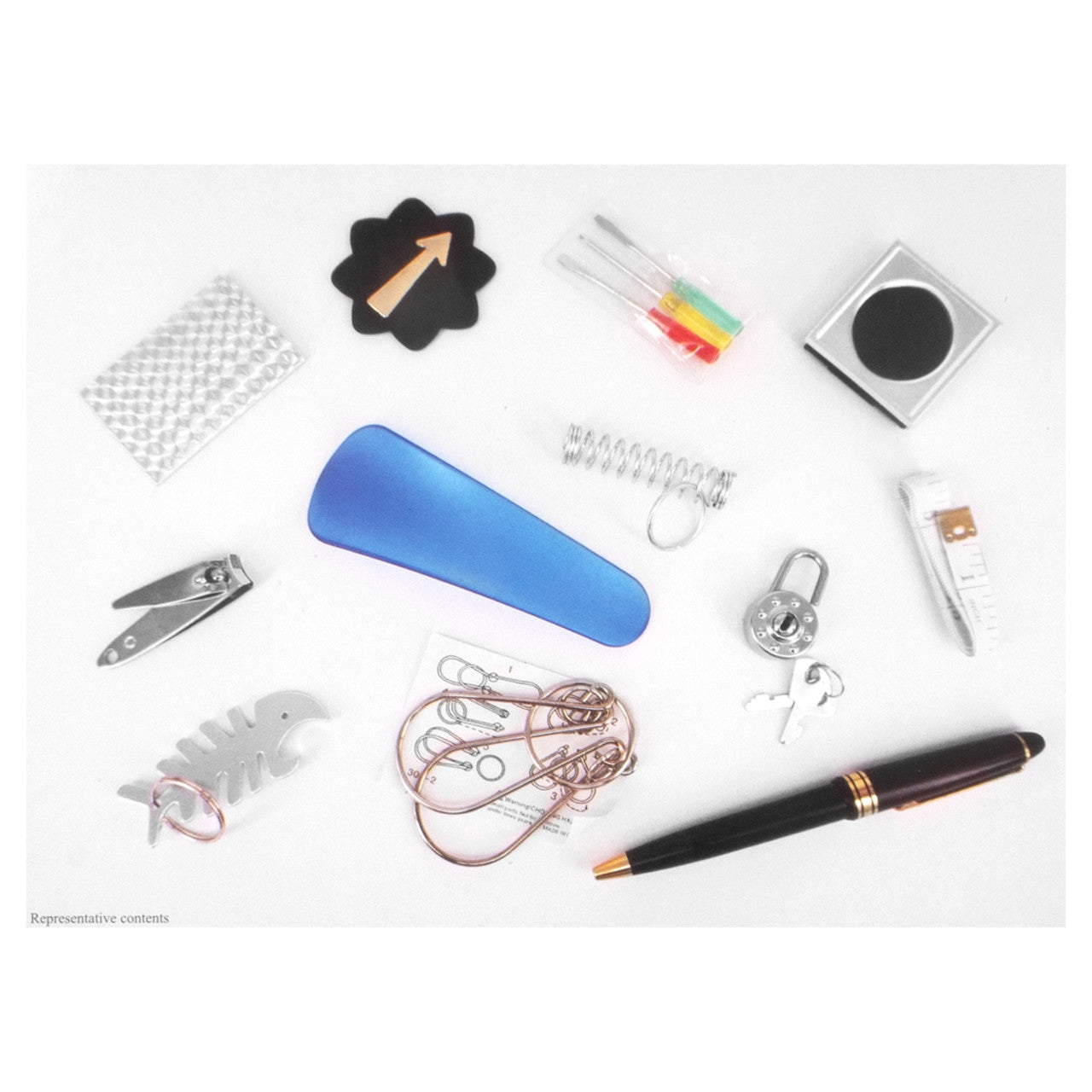 Party favor contents for Pudding Lane Christmas crackers on a white background featuring nail clippers, a pen, a mini screwdriver set, and other items.
