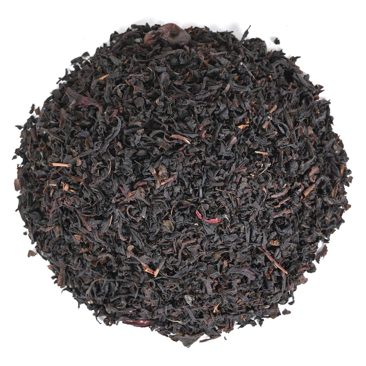 Close-up of black tea leaves on a white background