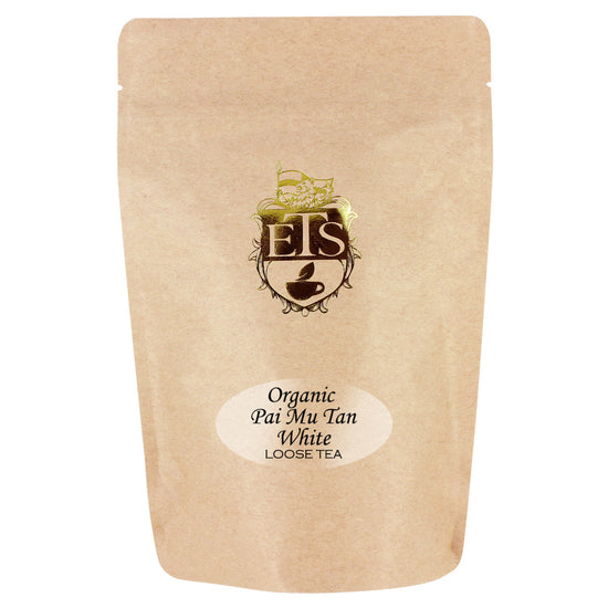 Kraft paper packaging of Organic Pai Mu Tan White Loose Tea with a logo on a white background