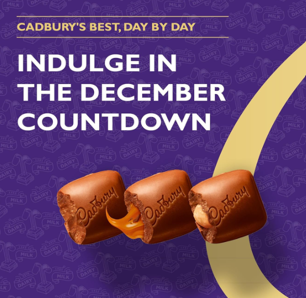 Cadbury Dairy Milk Advent Calendar packaging with gold illustrations on a purple background close up