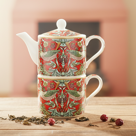 William Morris Strawberry Thief Tea for One decorative teapot with a colorful pattern on a table.
