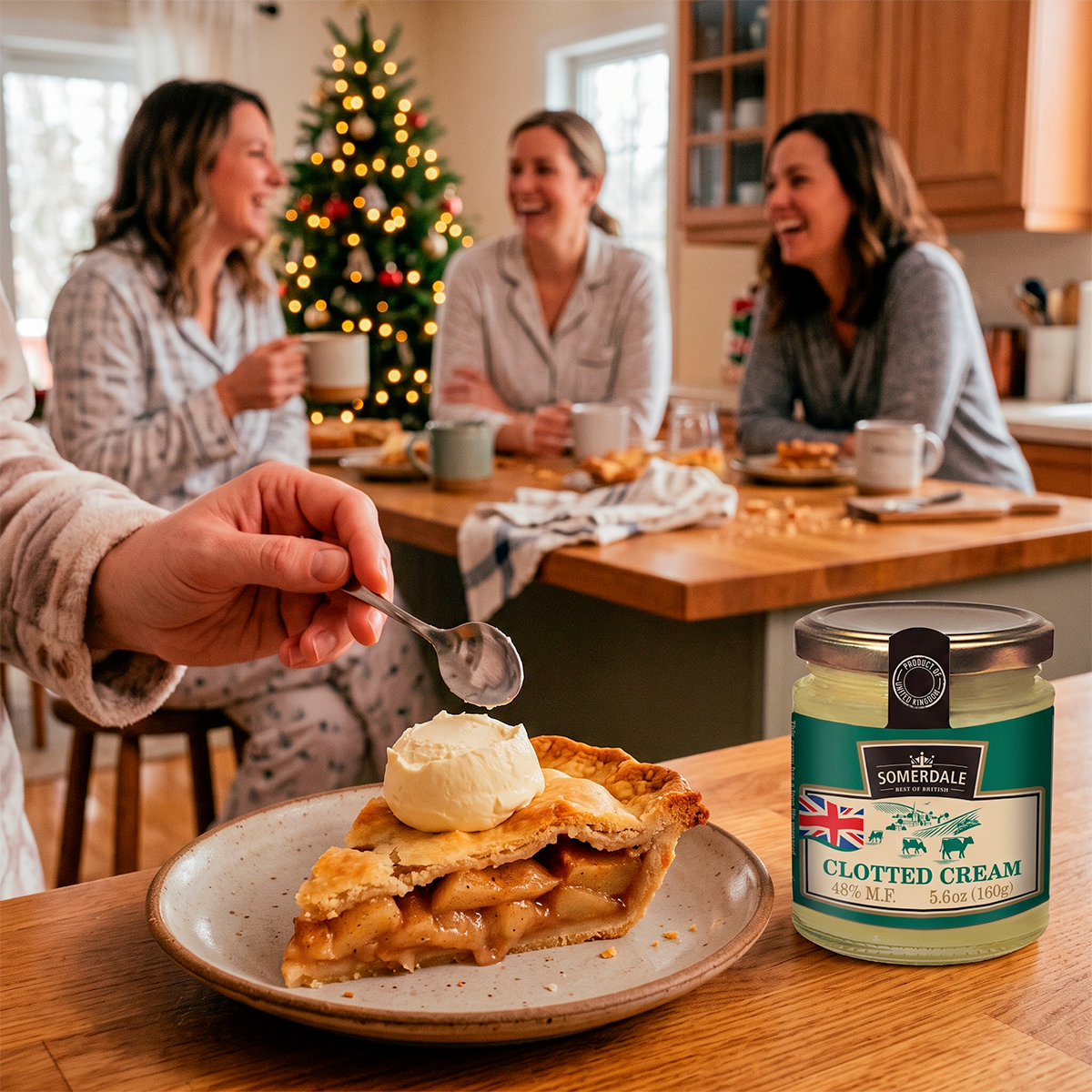Hand spooning cream onto a slice of pie beside a jar of clotted cream, with people at a table behind