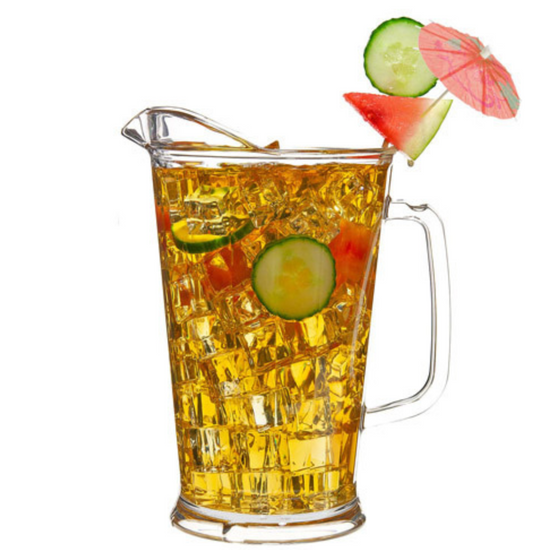 Glass pitcher filled with iced tea garnished with cucumber slices and watermelon, on a white background