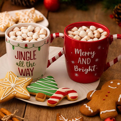 Two mugs with hot chocolate and marshmallows, surrounded by Christmas cookies on a wooden table.