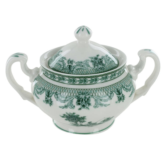 White porcelain sugar bowl with green floral patterns on a white background