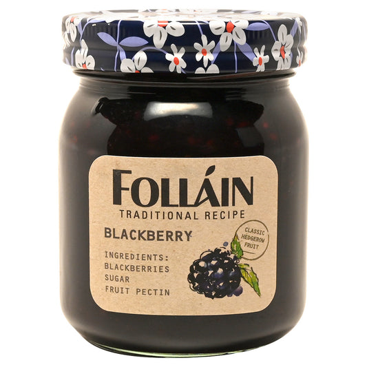 Jar of Folláin blackberry jam with decorative lid on a white background
