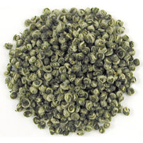 A close-up image of hand-rolled Jasmine Dragon Tears green tea pearls.