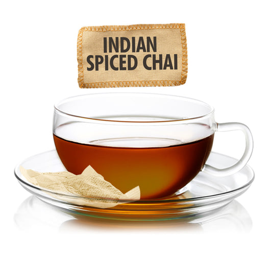 Clear glass cup of Indian Spiced Chai with a label above it on a white background