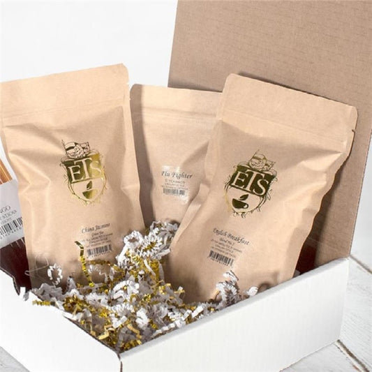 Three brown bags with a logo on a white surface