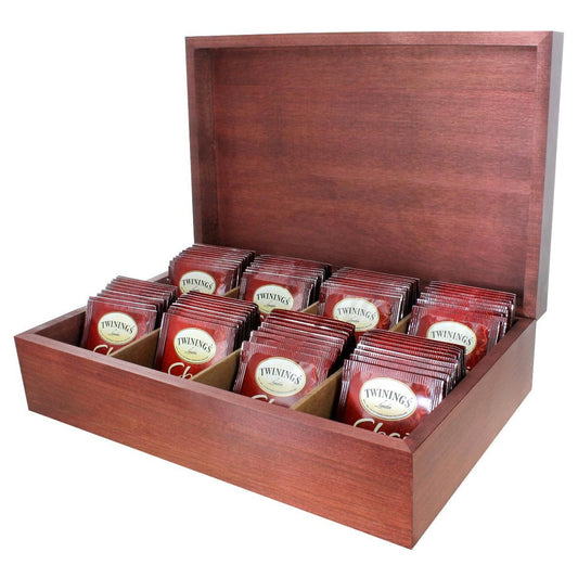 A wooden tea chest with multiple compartments, each filled with red Twinings Chai tea bags.
