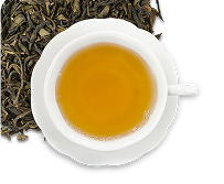 Image icon of dry loose-leaf tea in the upper corner underneath a white teacup and saucer filled with yellow colored hot tea