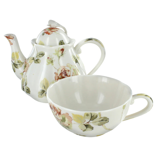 Porcelain teapot and cup set with floral design on a white background
