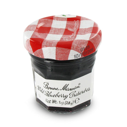 Small jar of Bonne Maman Wild Blueberry Preserve with a red and white checkered lid on a white background