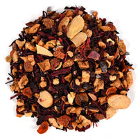 A pile of loose-leaf herbal tisane mixed with chunky dried fruit pieces