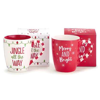 Two Christmas-themed mugs with decorative text and packaging on a white background