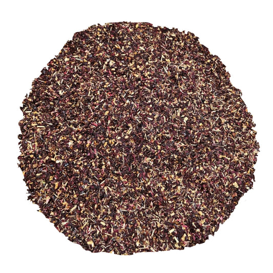 Round finely grounded dark tea leaves on a white background