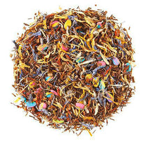 Colorful dried tea leaves and flower petals on a white background