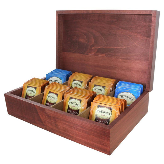 A solid wood tea chest in black, opened to display rows of individually wrapped Twinings tea bags, arranged by flavor.