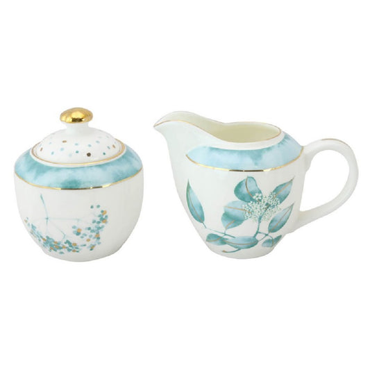 Creamer and sugar bowl set with floral design on a white background