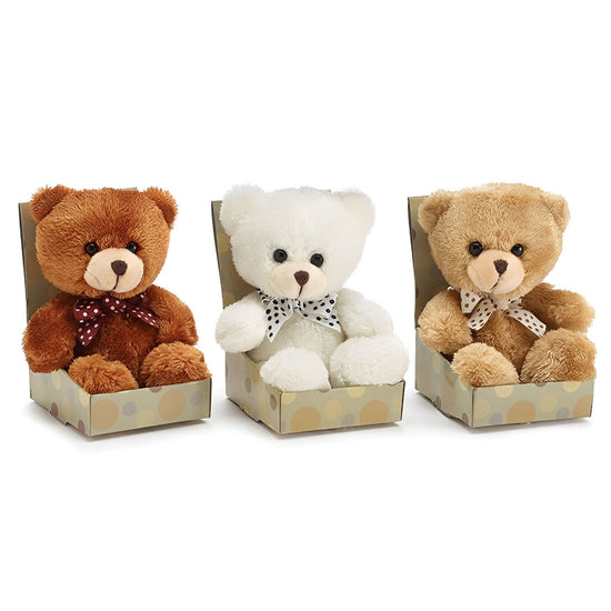Three teddy bears in decorative boxes on a white background
