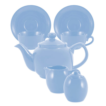 Blue ceramic tea set with teapot, cups, and sugar bowl on a white background