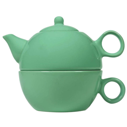 Sea foam green ceramic teapot and cup combo set on a white background