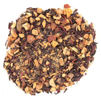 Assorted dried tea leaves and fruit pieces on a white background
