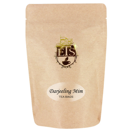 Kraft paper tea bag packaging with 'ETS' logo and 'Darjeeling Mim' text on a white background