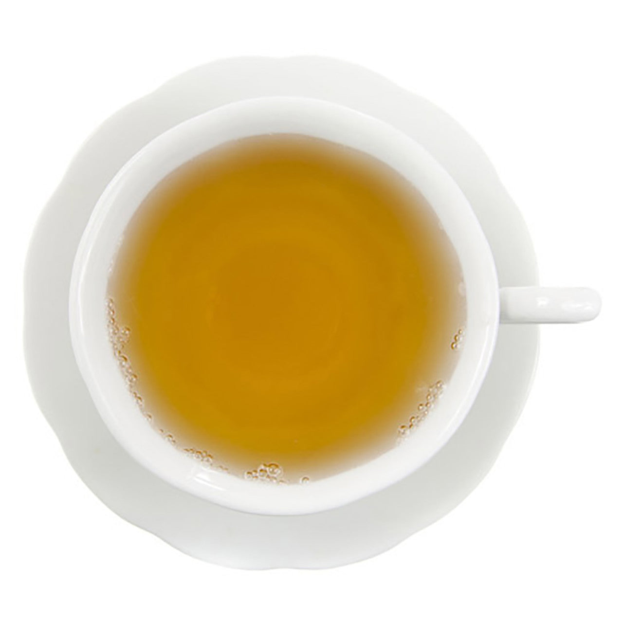 White cup with yellow colored hot tea on a white background