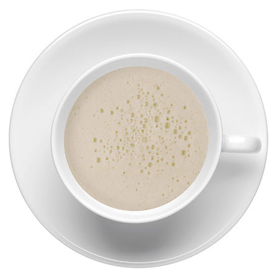 White cup with creamy beverage on a white saucer