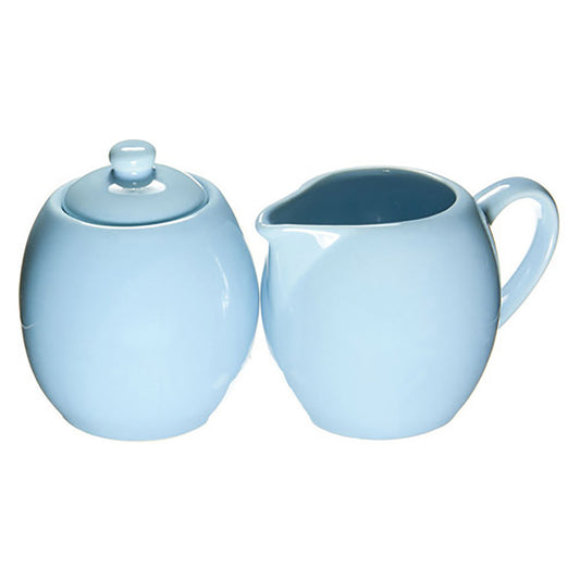 Light blue ceramic sugar bowl and creamer white background