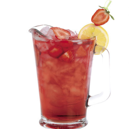 Glass pitcher of red fruit punch with strawberries and lemon slices on a white background