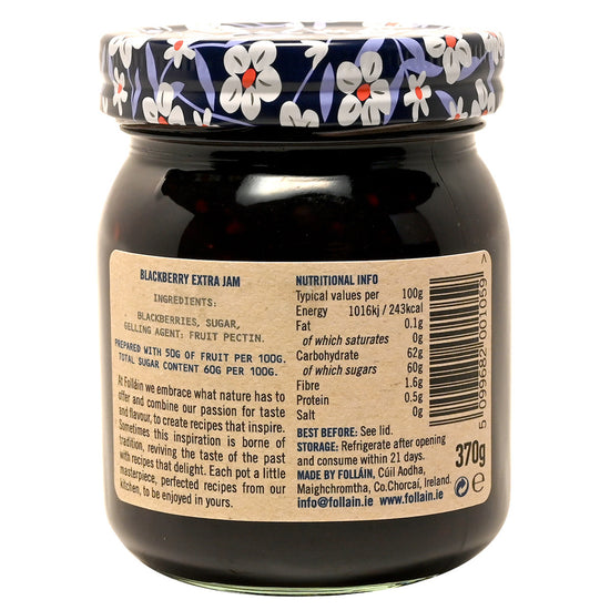 Back view of a jar of Follain blackberry extra jam with a floral lid.