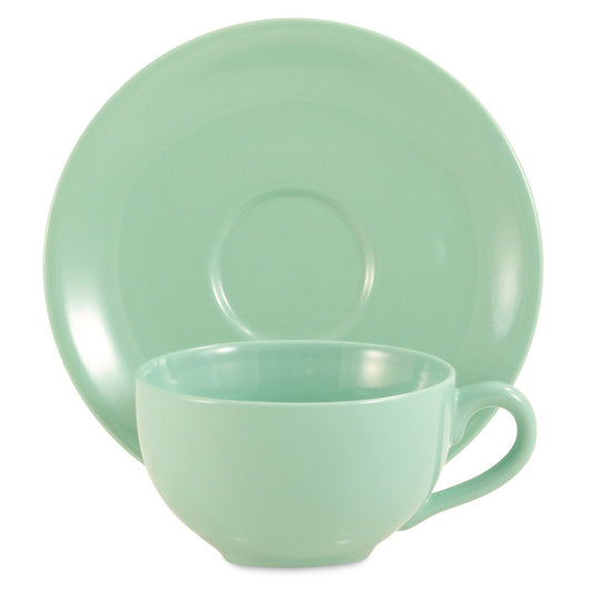Sea foam green ceramic teacup and saucer set on a white background