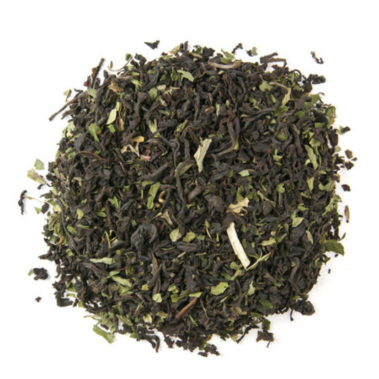 Dry green tea leaves on a white background