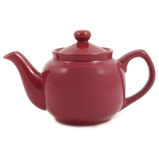Red teapot on a white background